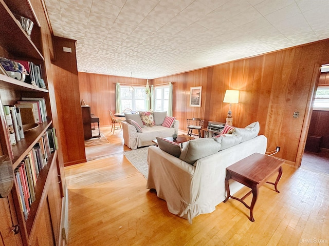812 Spruce St, Marquette, MI 49855 - living room featuring healthy amount of natural light, wood walls, and light wood finished floors