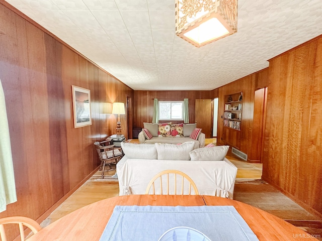 812 Spruce St, Marquette, MI 49855 - dining area with wood finished floors and wooden walls