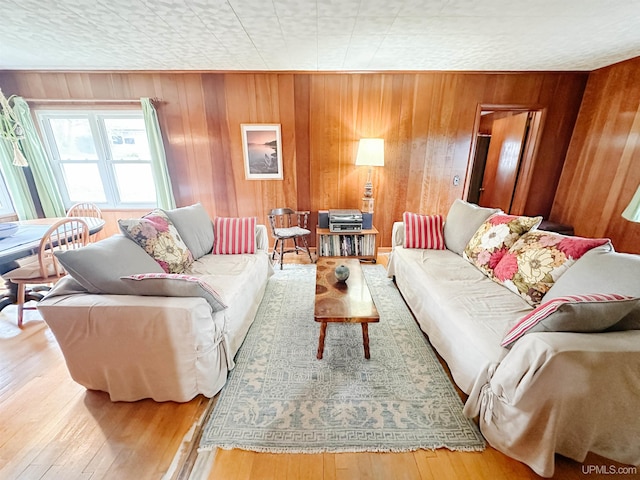 812 Spruce St, Marquette, MI 49855 - living room featuring wood walls and hardwood / wood-style floors