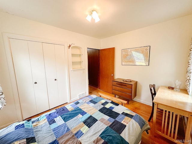 812 Spruce St, Marquette, MI 49855 - bedroom with light wood-type flooring and a closet