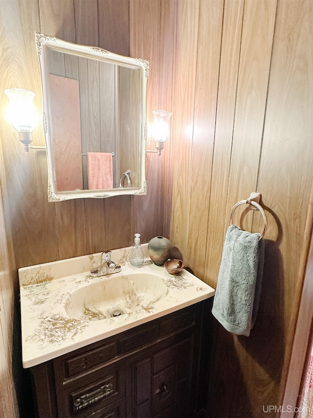 812 Spruce St, Marquette, MI 49855 - bathroom with vanity and wooden walls