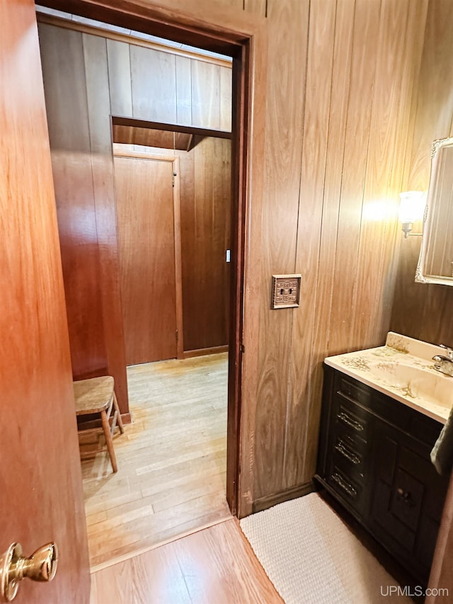 812 Spruce St, Marquette, MI 49855 - bathroom with vanity, wood-type flooring, and wood walls