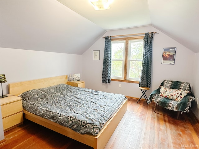 812 Spruce St, Marquette, MI 49855 - bedroom featuring hardwood / wood-style flooring and vaulted ceiling