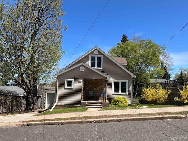 812 Spruce St, Marquette, MI 49855 - bungalow-style house featuring brick siding and a garage