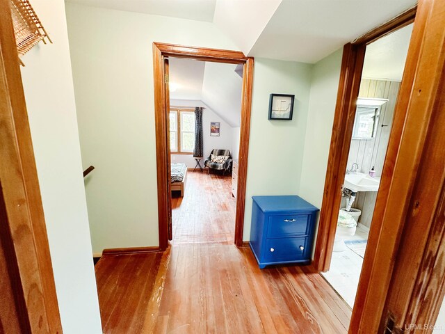 812 Spruce St, Marquette, MI 49855 - hallway with hardwood / wood-style flooring, lofted ceiling, and baseboards