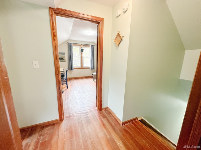 812 Spruce St, Marquette, MI 49855 - hallway with wood finished floors, lofted ceiling, and baseboards