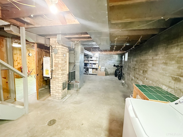 812 Spruce St, Marquette, MI 49855 - unfinished basement with washer / clothes dryer and tankless water heater