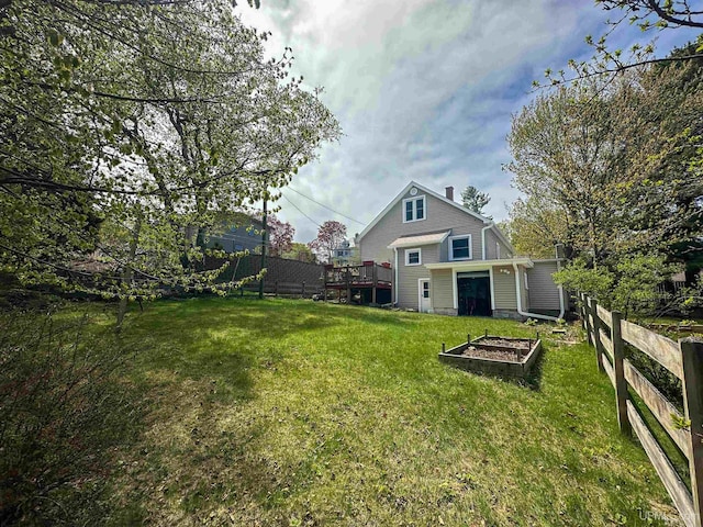 812 Spruce St, Marquette, MI 49855 - view of yard featuring a vegetable garden and a deck