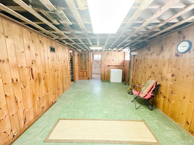 812 Spruce St, Marquette, MI 49855 - below grade area with wood walls and fridge