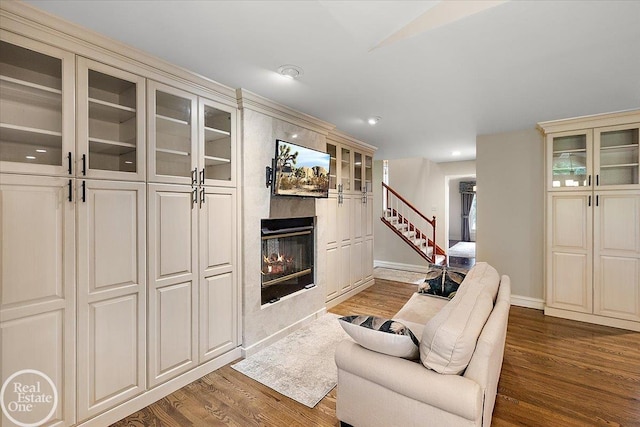 63011 Indian Hills Dr Unit # 1, Washington Twp, MI 48095 - living area featuring wood finished floors, stairs, a premium fireplace, baseboards, and recessed lighting