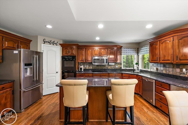 63011 Indian Hills Dr Unit # 1, Washington Twp, MI 48095 - kitchen with black appliances, backsplash, dark wood-type flooring, and recessed lighting