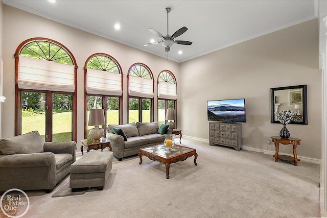 63011 Indian Hills Dr Unit # 1, Washington Twp, MI 48095 - carpeted living room featuring ceiling fan, baseboards, recessed lighting, ornamental molding, and a high ceiling