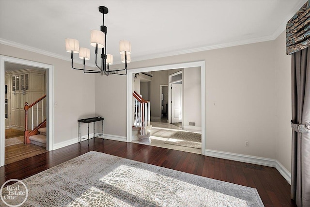 63011 Indian Hills Dr Unit # 1, Washington Twp, MI 48095 - unfurnished dining area featuring stairway, hardwood / wood-style floors, baseboards, a chandelier, and crown molding