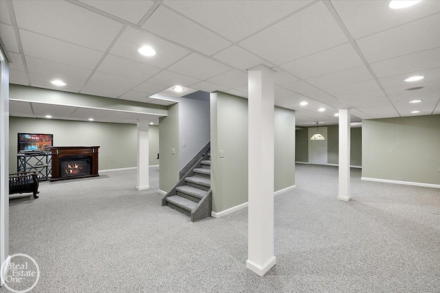 63011 Indian Hills Dr Unit # 1, Washington Twp, MI 48095 - finished below grade area featuring baseboards, carpet floors, a lit fireplace, recessed lighting, and a paneled ceiling