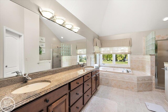 63011 Indian Hills Dr Unit # 1, Washington Twp, MI 48095 - full bath with a shower stall, a bath, tile patterned flooring, double vanity, and lofted ceiling