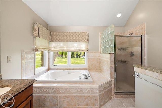 63011 Indian Hills Dr Unit # 1, Washington Twp, MI 48095 - full bath featuring lofted ceiling, a garden tub, a shower stall, vanity, and tile patterned flooring
