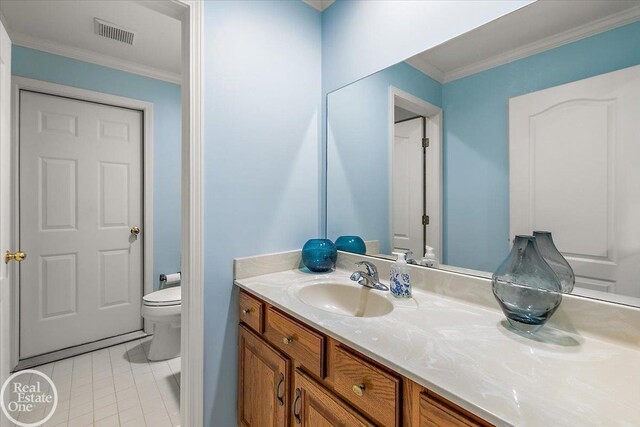 63011 Indian Hills Dr Unit # 1, Washington Twp, MI 48095 - bathroom with toilet, vanity, tile patterned flooring, and ornamental molding