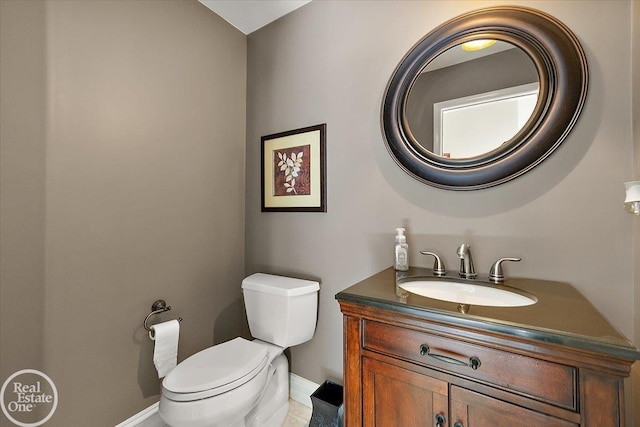 63011 Indian Hills Dr Unit # 1, Washington Twp, MI 48095 - half bath featuring vanity, toilet, and baseboards