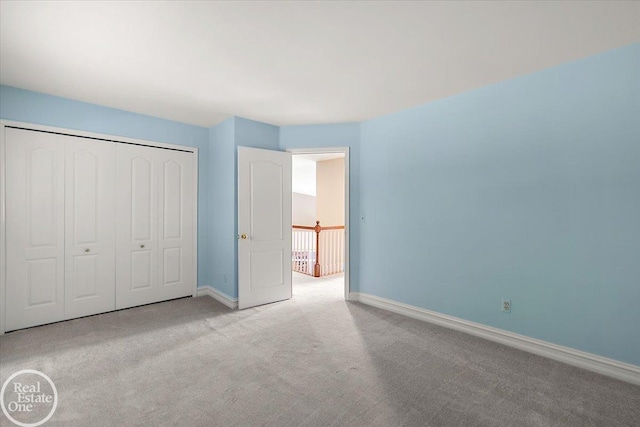 63011 Indian Hills Dr Unit # 1, Washington Twp, MI 48095 - unfurnished bedroom with baseboards, carpet, and a closet