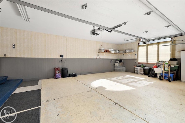 63011 Indian Hills Dr Unit # 1, Washington Twp, MI 48095 - garage with a garage door opener and a wainscoted wall