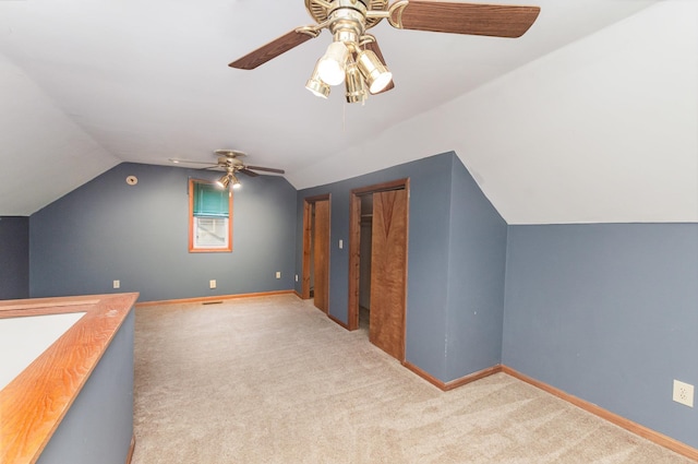 205 E Murphy St, Bay City, MI 48706 - additional living space featuring carpet, lofted ceiling, a ceiling fan, and baseboards