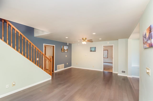 205 E Murphy St, Bay City, MI 48706 - unfurnished living room with recessed lighting, wood finished floors, stairway, a ceiling fan, and baseboards
