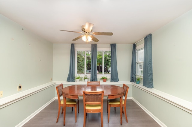 205 E Murphy St, Bay City, MI 48706 - dining area featuring wood finished floors, a ceiling fan, and baseboards