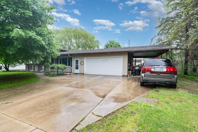 4719 Myra Lee Dr, Auburn, MI 48611 - view of front of property with a garage, driveway, a front lawn, and an attached carport
