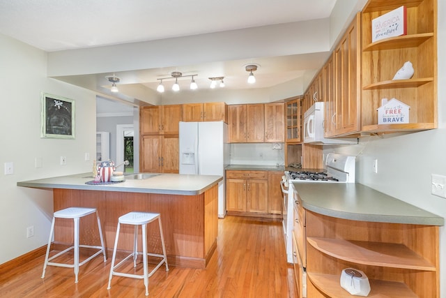 4719 Myra Lee Dr, Auburn, MI 48611 - kitchen featuring open shelves, white appliances, a peninsula, a sink, and light wood-style flooring