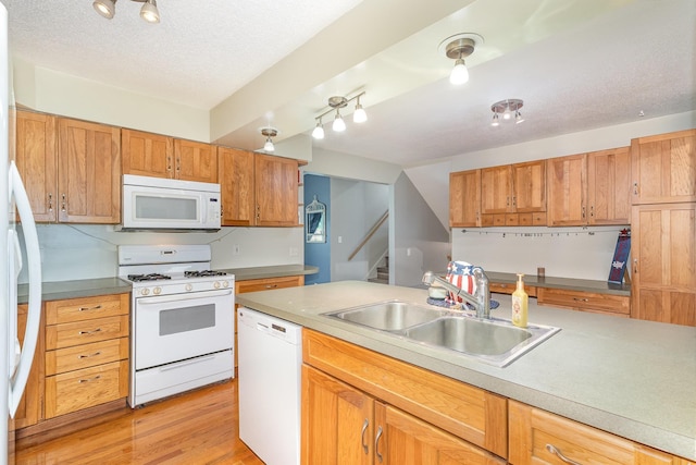 4719 Myra Lee Dr, Auburn, MI 48611 - kitchen featuring white appliances, a sink, light wood-style floors, light countertops, and a textured ceiling