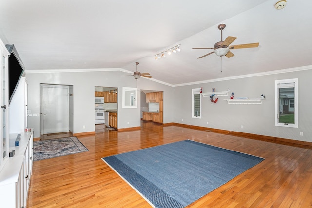4719 Myra Lee Dr, Auburn, MI 48611 - living room with ceiling fan, light wood-style floors, vaulted ceiling, baseboards, and ornamental molding