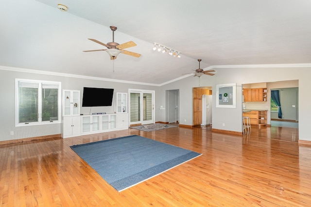 4719 Myra Lee Dr, Auburn, MI 48611 - unfurnished living room featuring ceiling fan, vaulted ceiling, baseboards, light wood finished floors, and ornamental molding