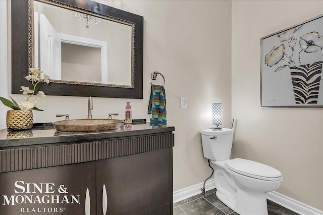 55266 Lordona Ln, Shelby Twp, MI 48315 - half bath with baseboards, vanity, and toilet
