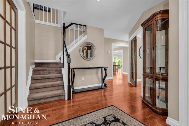 55266 Lordona Ln, Shelby Twp, MI 48315 - staircase featuring wood finished floors, french doors, and baseboards