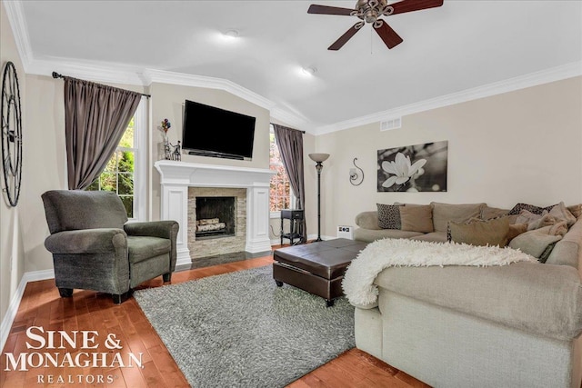 55266 Lordona Ln, Shelby Twp, MI 48315 - living room with a ceiling fan, ornamental molding, lofted ceiling, wood finished floors, and a fireplace with flush hearth