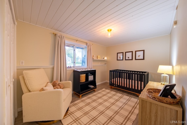 2091 Wilkinson Ave, Marquette, MI 49855 - bedroom with a crib and wooden ceiling