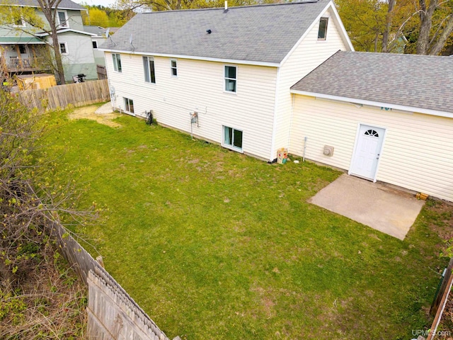 2091 Wilkinson Ave, Marquette, MI 49855 - rear view of property featuring roof with shingles and a patio