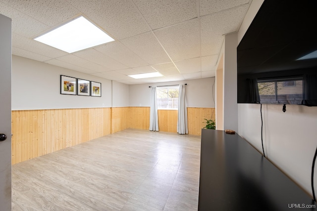 2091 Wilkinson Ave, Marquette, MI 49855 - empty room featuring a wainscoted wall, wooden walls, and a paneled ceiling