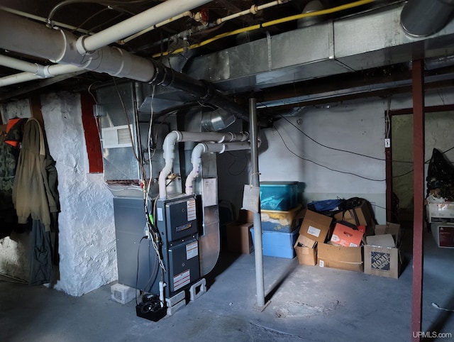 4203 E Maple Ridge 37th Rd, Rock, MI 49880 - unfinished basement featuring heating unit