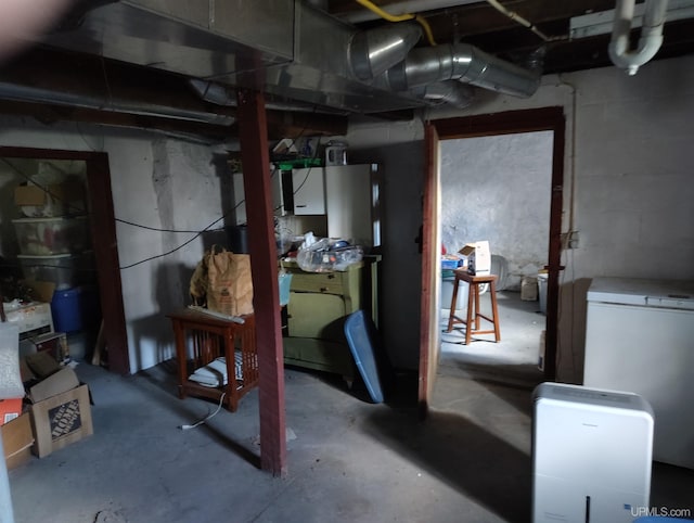 4203 E Maple Ridge 37th Rd, Rock, MI 49880 - unfinished basement with fridge