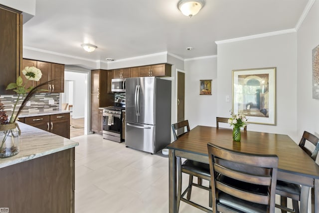 42910 Utica Rd, Sterling Heights, MI 48314 - dining space featuring ornamental molding