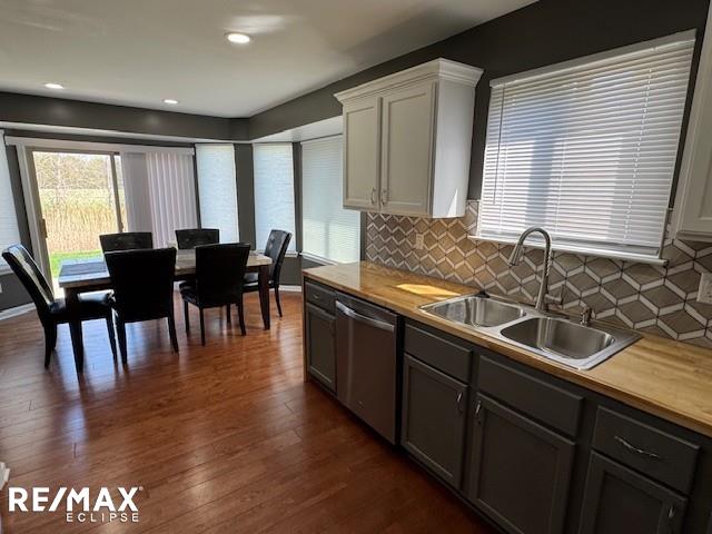 53234 Fox Pointe Dr, New Baltimore, MI 48047 - kitchen with dishwasher, a sink, tasteful backsplash, healthy amount of natural light, and recessed lighting