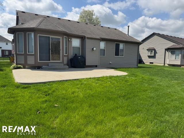 53234 Fox Pointe Dr, New Baltimore, MI 48047 - rear view of property featuring a patio and a lawn