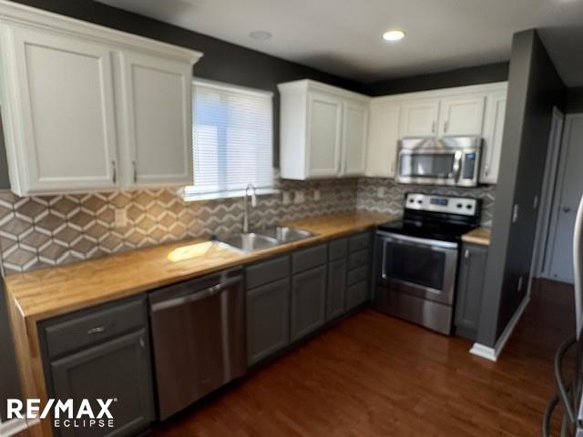 53234 Fox Pointe Dr, New Baltimore, MI 48047 - kitchen featuring appliances with stainless steel finishes, a sink, gray cabinetry, white cabinets, and recessed lighting