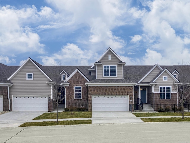 2215 Chase Dr Unit 102, Howell, MI 48855 - view of front of house featuring a garage, concrete driveway, brick siding, and roof with shingles