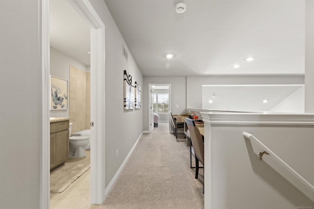 2215 Chase Dr Unit 102, Howell, MI 48855 - hallway featuring baseboards, recessed lighting, and light colored carpet