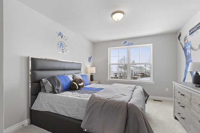 2215 Chase Dr Unit 102, Howell, MI 48855 - bedroom featuring light colored carpet and baseboards