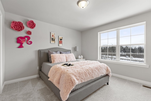 2215 Chase Dr Unit 102, Howell, MI 48855 - bedroom with baseboards and light carpet