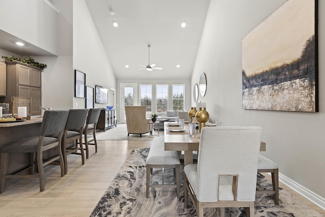 2215 Chase Dr Unit 102, Howell, MI 48855 - dining area featuring high vaulted ceiling, a ceiling fan, light wood finished floors, baseboards, and recessed lighting