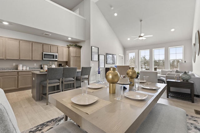 2215 Chase Dr Unit 102, Howell, MI 48855 - dining room featuring high vaulted ceiling, a ceiling fan, light wood finished floors, and recessed lighting